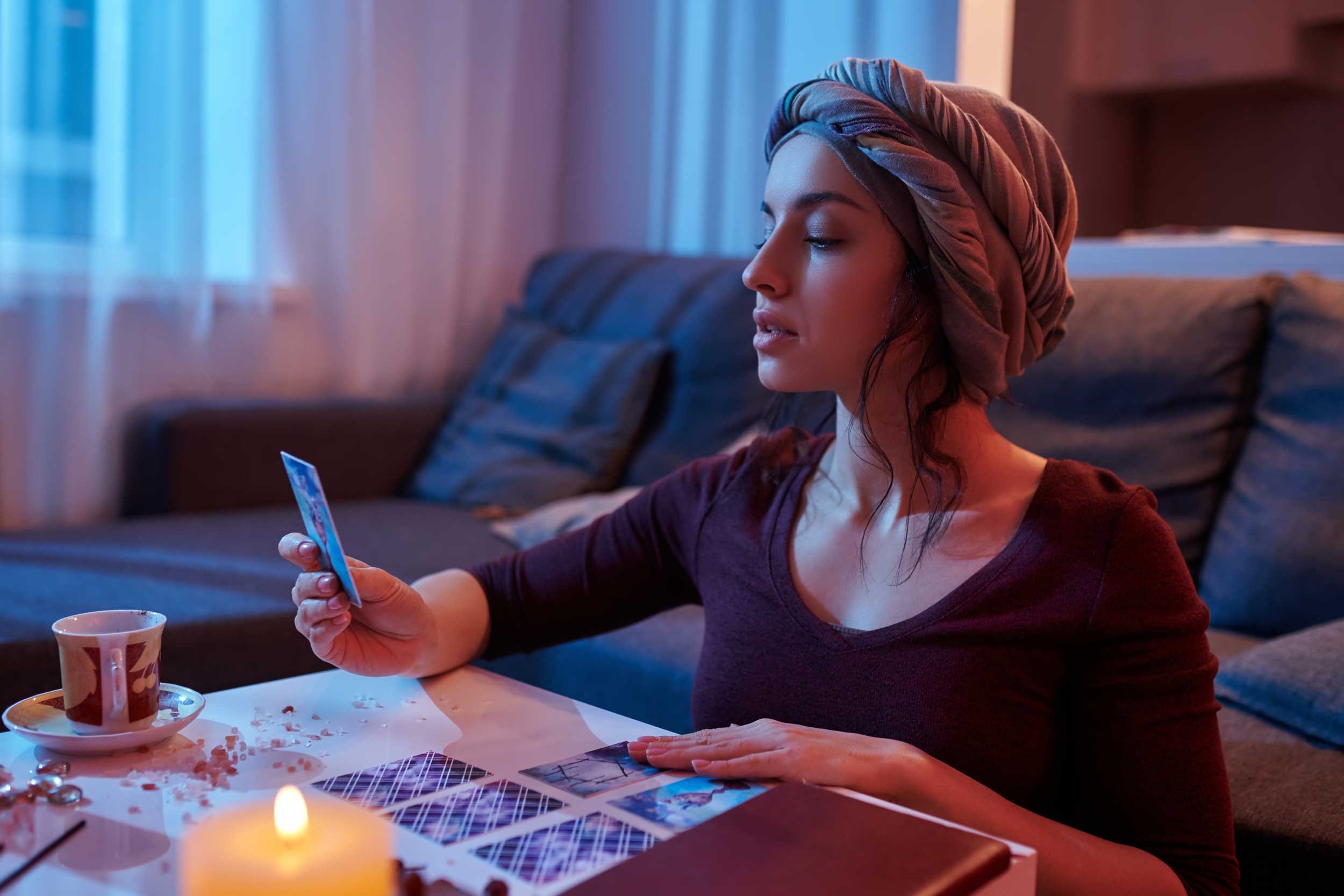 A young woman reading tarot.